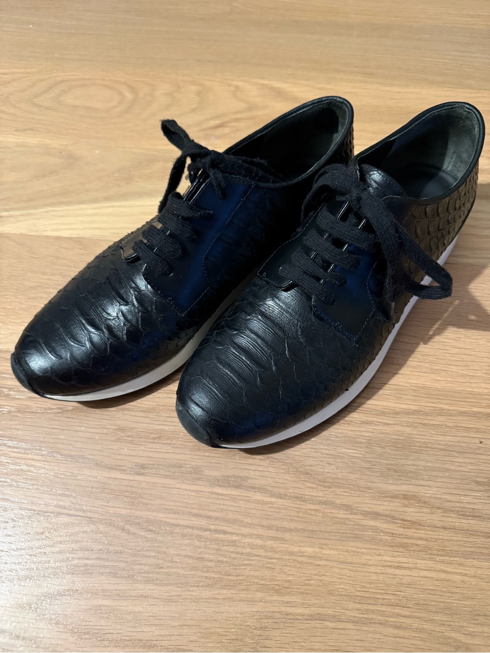 Vince Rayner sneakers in black with a snakeskin-embossed leather